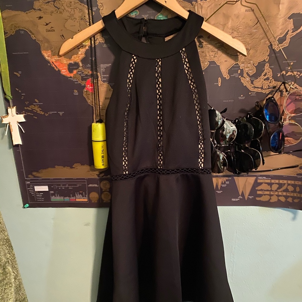 Black halter style dress with mesh detailing